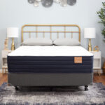 Atlas mattress in a bedroom with an olive tree and light curtains